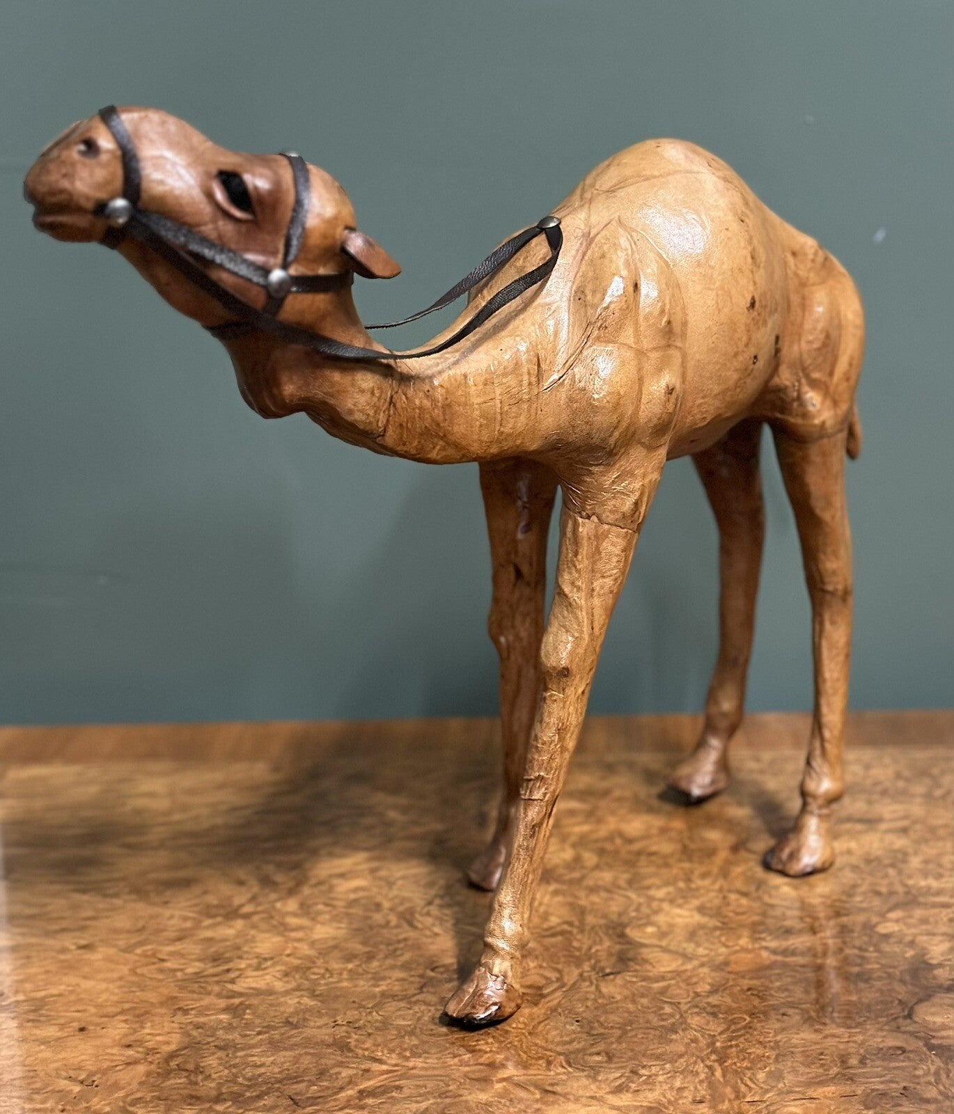 LiBERTY'S LONDON CAMEL SCULPTURE WITH LOVELY AGED LEATHER ON HAND CARVED WOOD