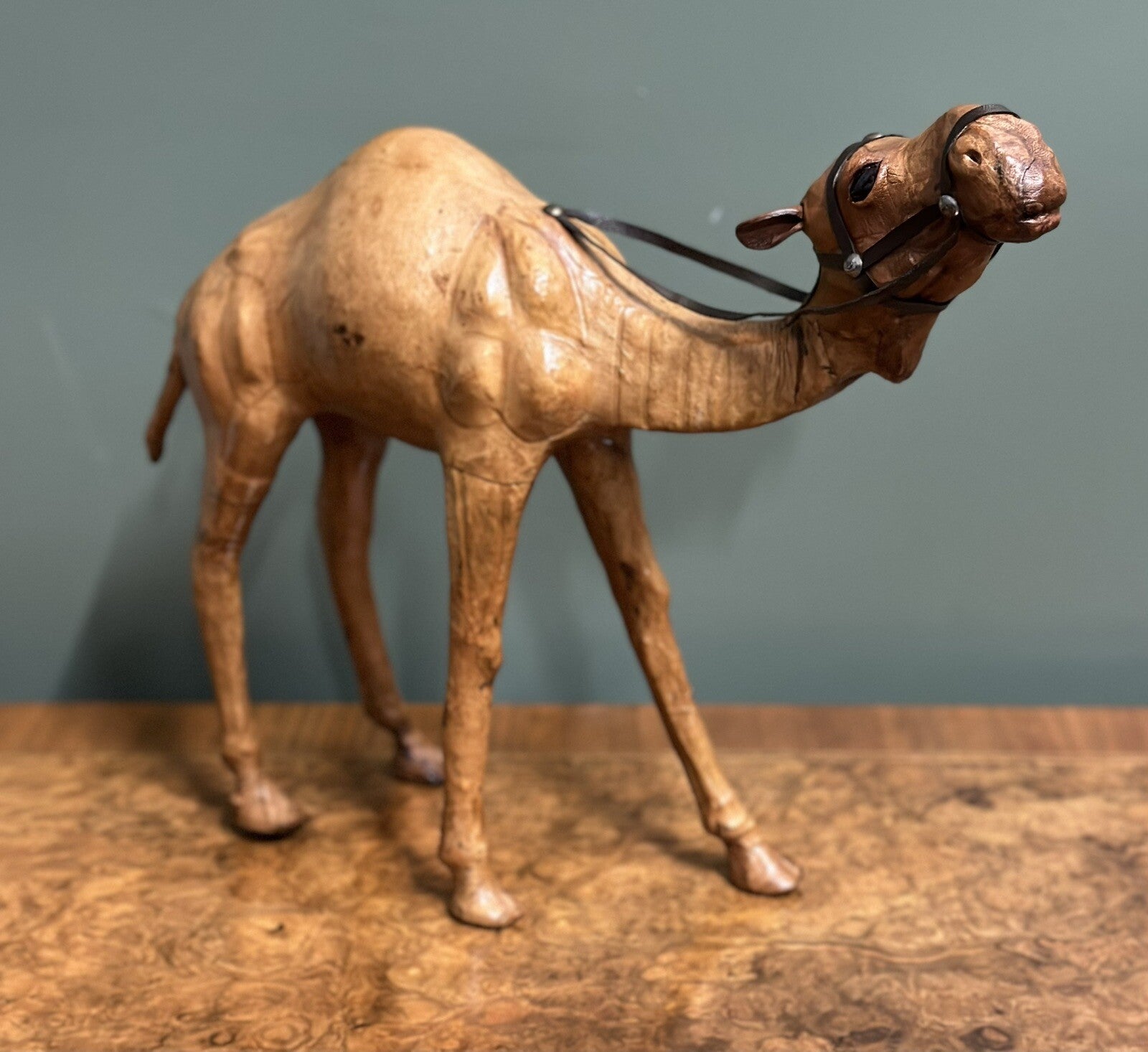LiBERTY'S LONDON CAMEL SCULPTURE WITH LOVELY AGED LEATHER ON HAND CARVED WOOD