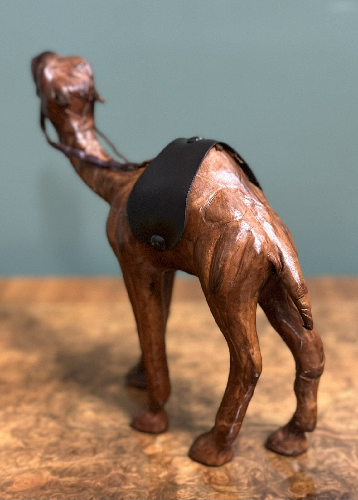 CAMEL SCULPTURE WITH LOVELY AGED LEATHER ON HAND CARVED WOOD BY LIBERTYS LONDON