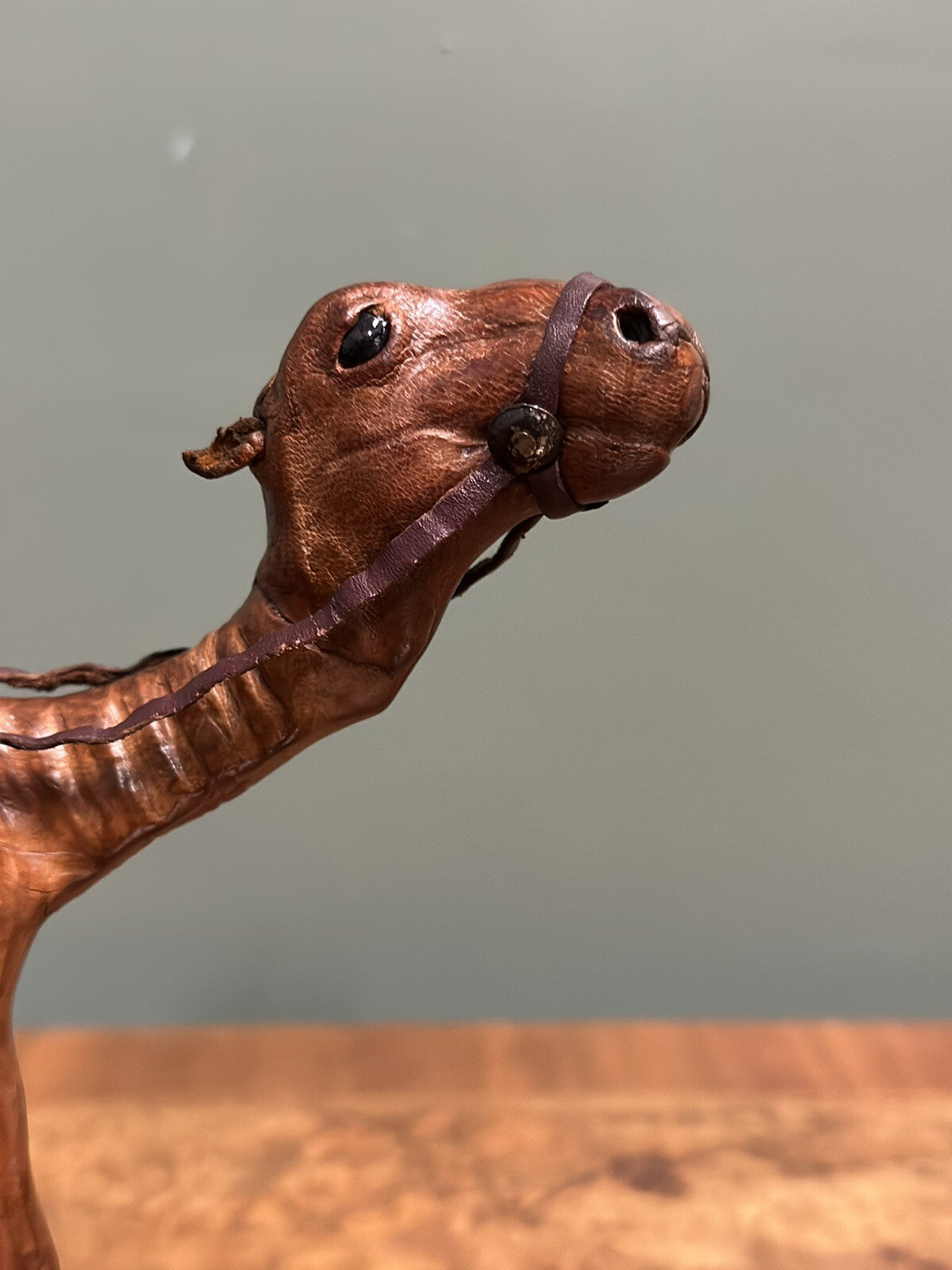 CAMEL SCULPTURE WITH LOVELY AGED LEATHER ON HAND CARVED WOOD BY LIBERTYS LONDON