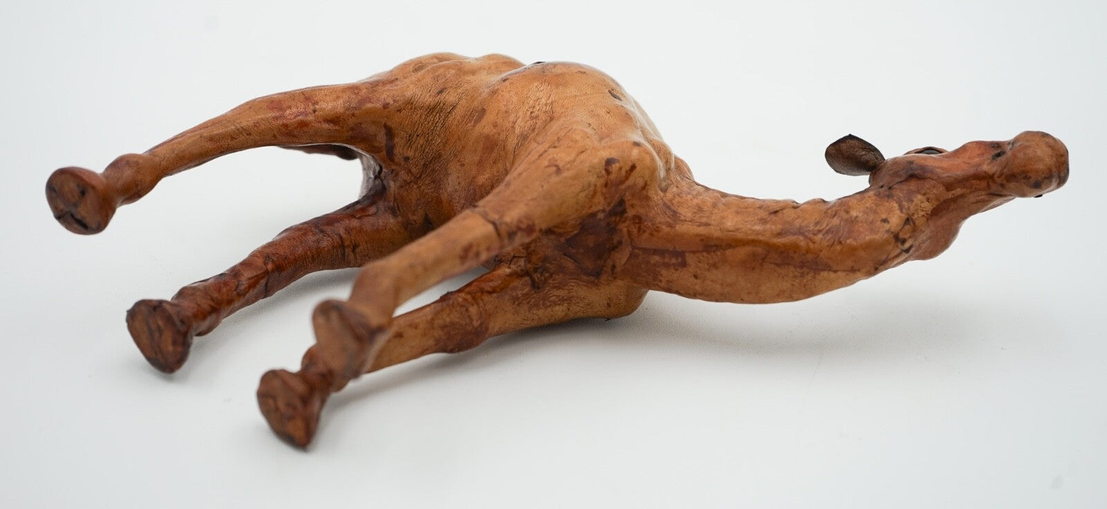 CAMEL SCULPTURE WITH  AGED LEATHER ON HAND CARVED WOOD BY LIBERTY'S LONDON