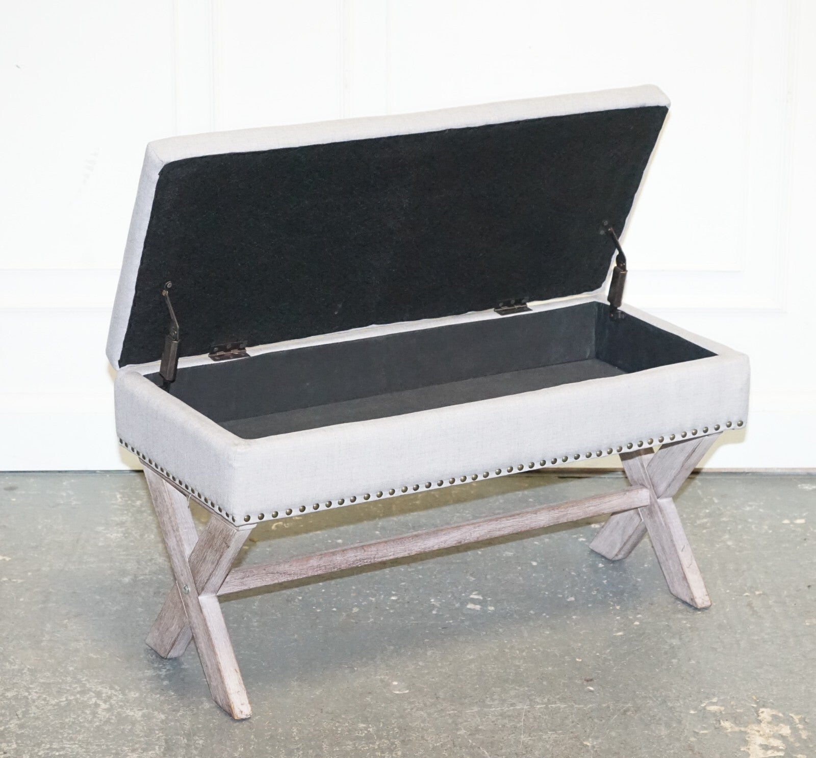 LOVELY VINTAGE GREY TAUPE FABRIC OTTOMAN WITH STORAGE SPACE RAISED ON X FRAME