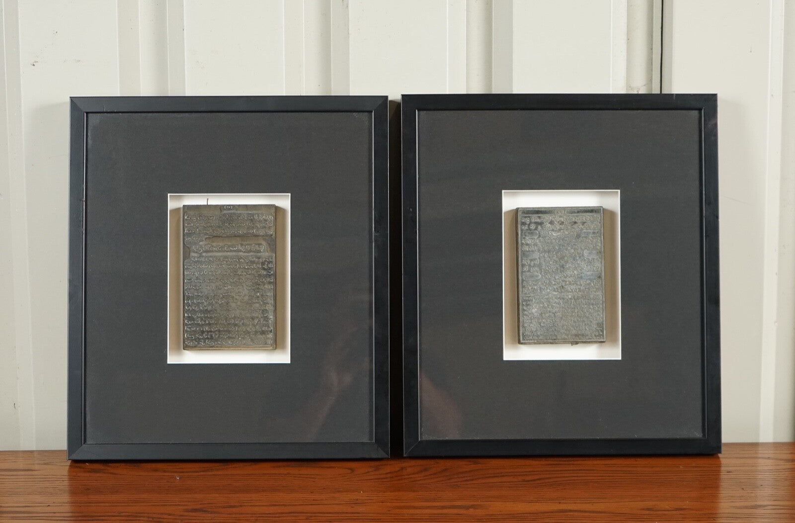 PAIR OF ARABIC WRITINGS FRAMED IN MODERN BLACK FRAMES