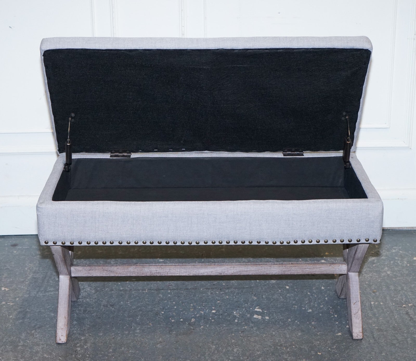 LOVELY VINTAGE GREY TAUPE FABRIC OTTOMAN WITH STORAGE SPACE RAISED ON X FRAME