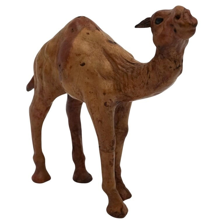CAMEL SCULPTURE WITH  AGED LEATHER ON HAND CARVED WOOD BY LIBERTY'S LONDON