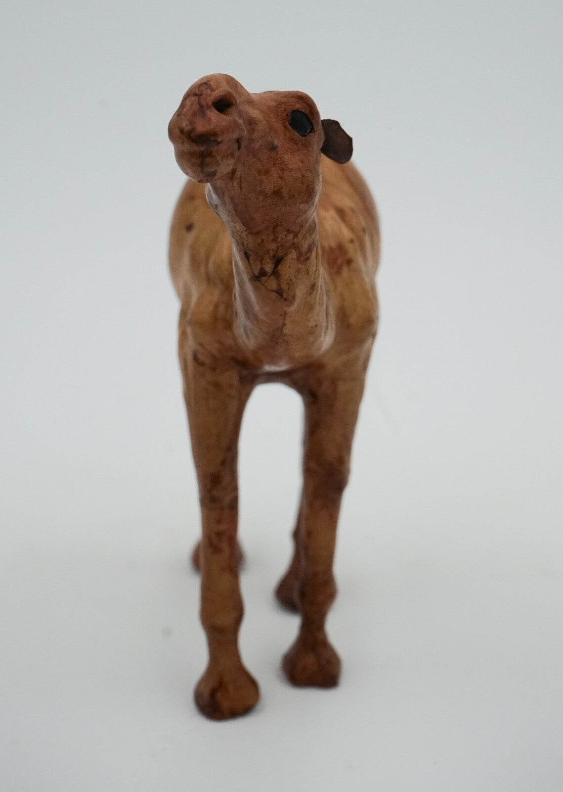 CAMEL SCULPTURE WITH  AGED LEATHER ON HAND CARVED WOOD BY LIBERTY'S LONDON