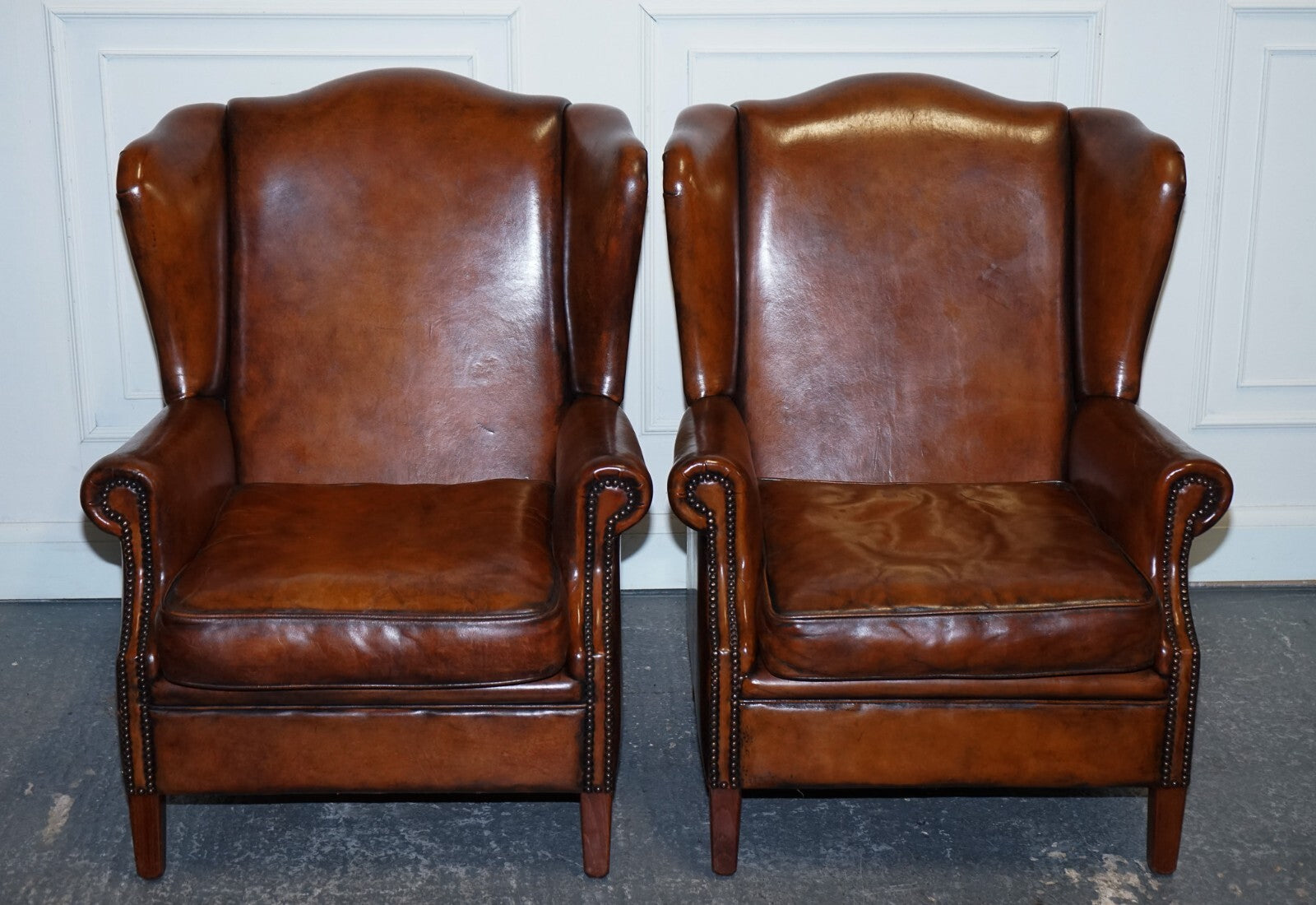 ANTIQUE PAIR OF DUTCH HAND DYED BROWN CATTLE LEATHER WINGBACK ARMCHAIRS