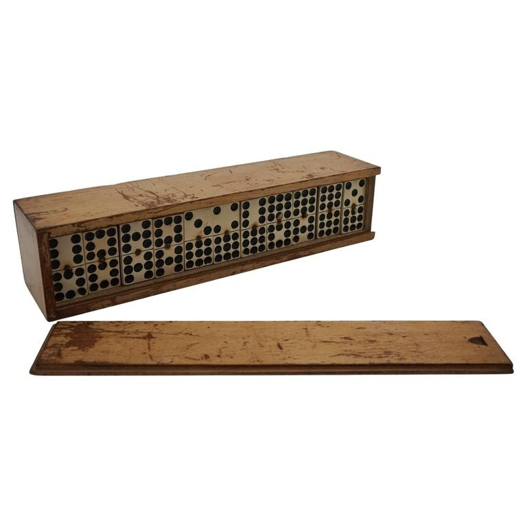 LATE 19TH CENTURY BOX OF TRADITIONAL GAME NINER DOMINOS WITH STUNNING PATINA
